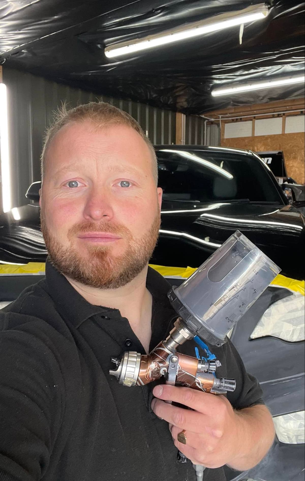 Tom Bell working on car repair